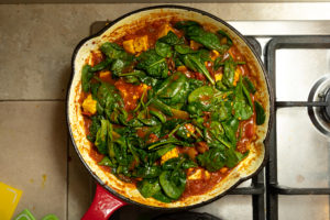 Add baby spinach leaves to curry