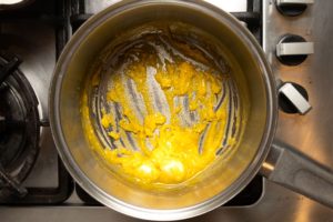 Flour added to pot and mixed into margarine to create a roux