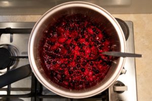 Frozen berries in a pot on the stove