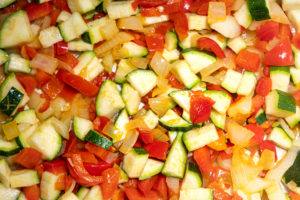 Courgette added to pan with onion, capsicum and chilli