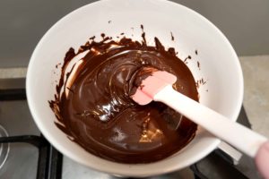 Chocolate melted in a bowl over simmering water